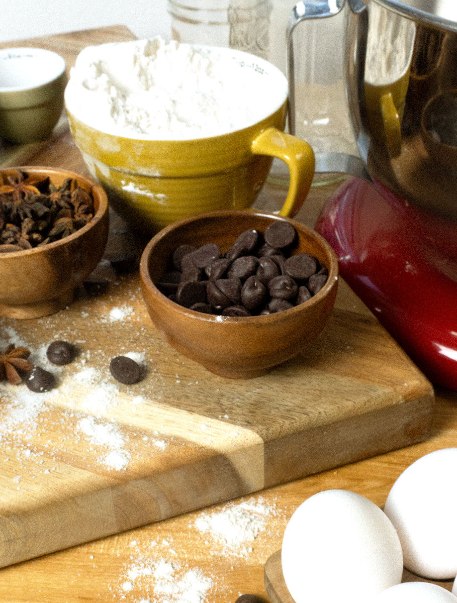 mixing bowls and mesuring cups with baking ingridents.