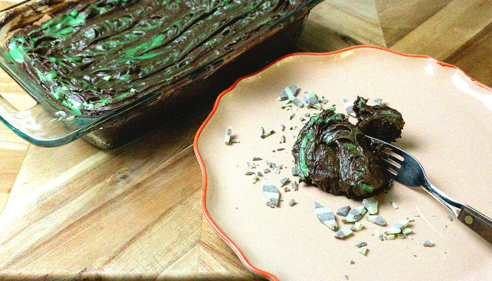 Brownie and fork on plate