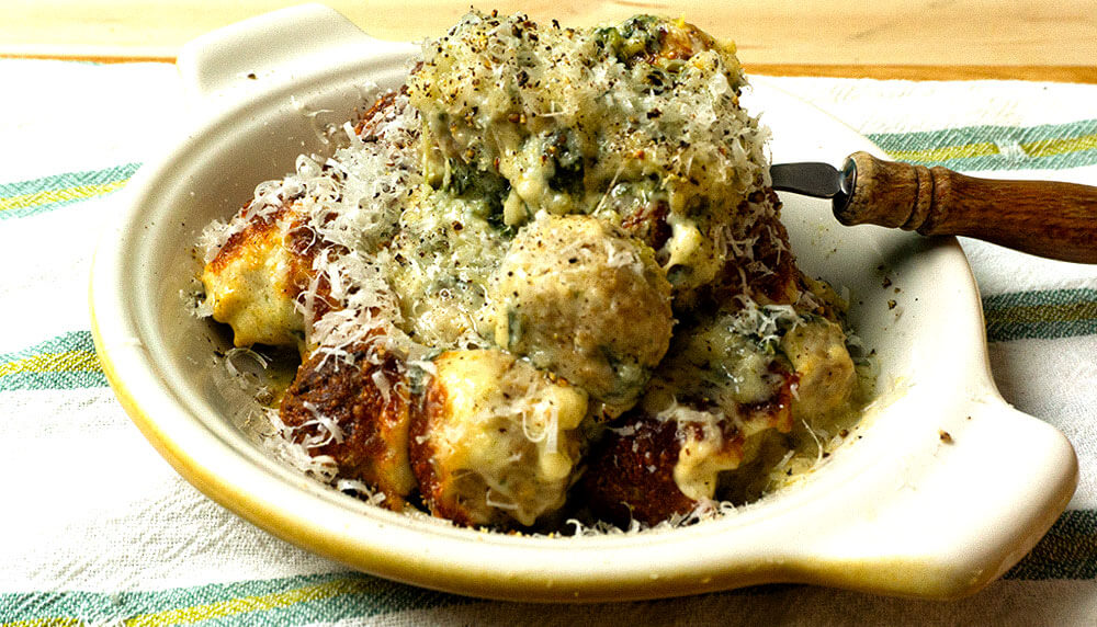 Meatballs with rice with fork in a bowl