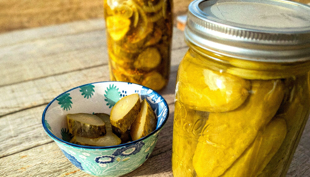 pickles in jars and in a small bowl.